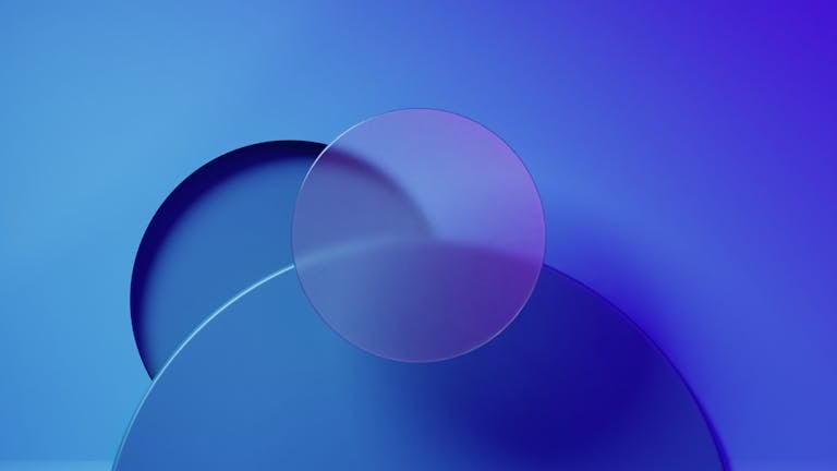 Minimalist abstract design featuring overlapping blue and purple geometric shapes.